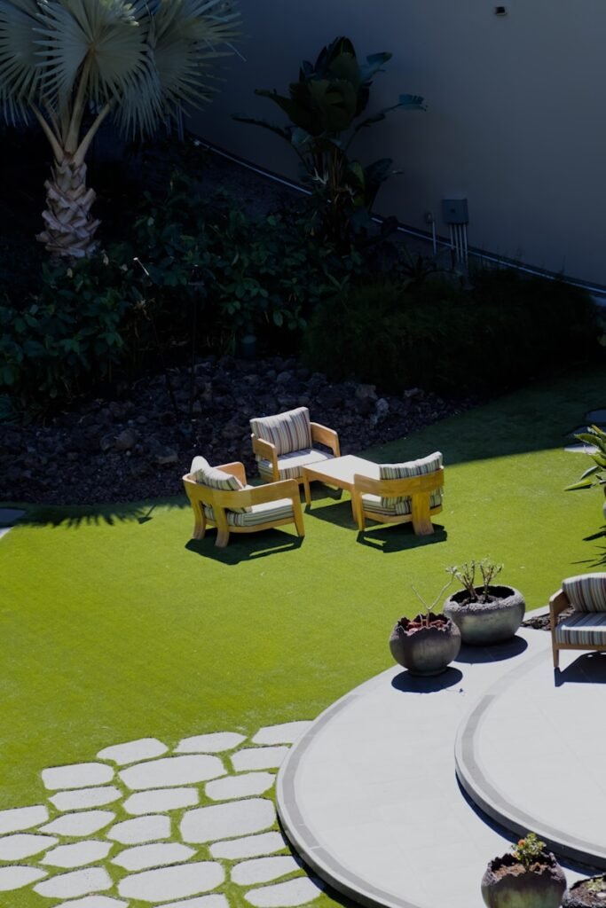 A garden with a lawn and seating area