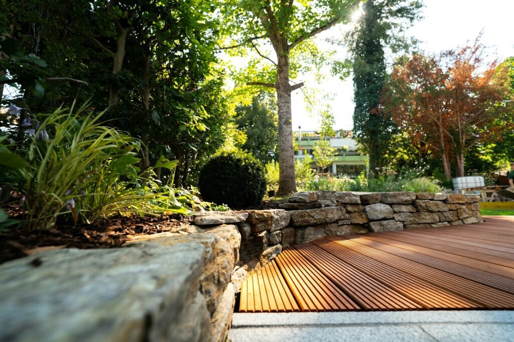 A wooden deck surrounded by rocks and trees