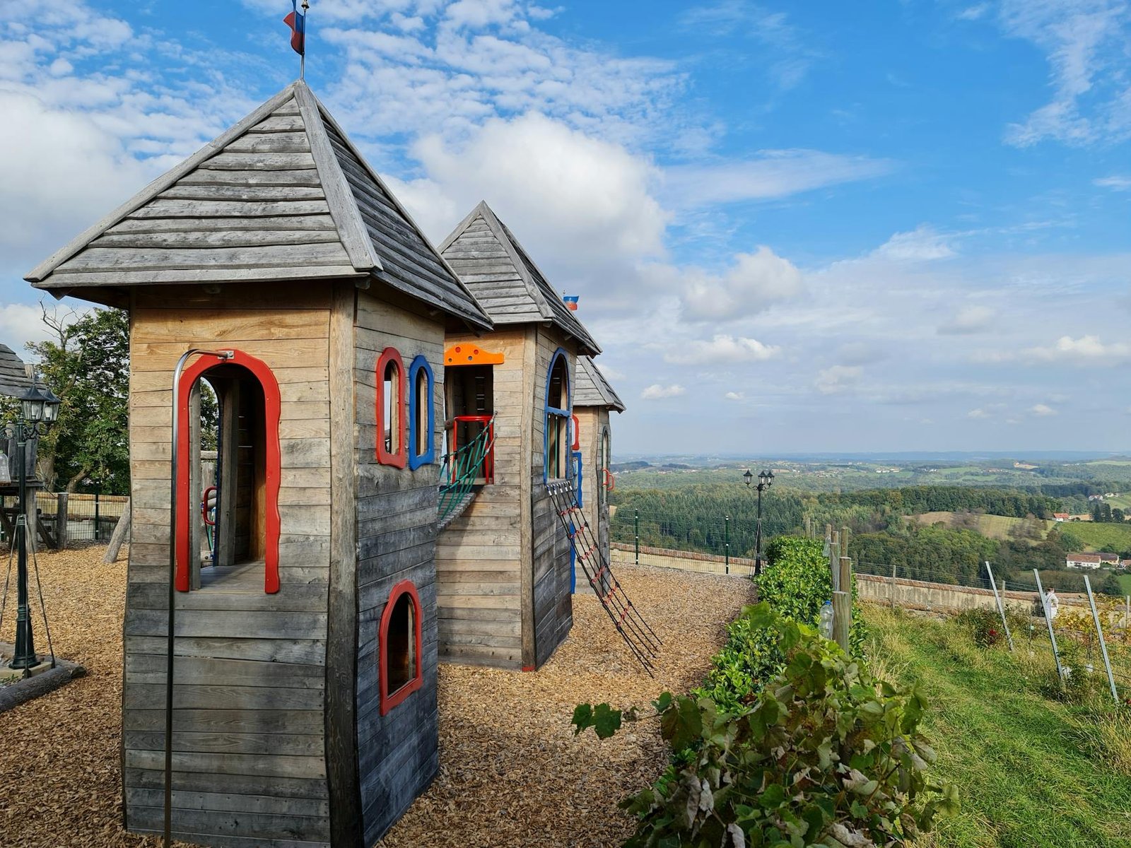 wooden playground castle overlooking scenic vista, Kids' Play Castles